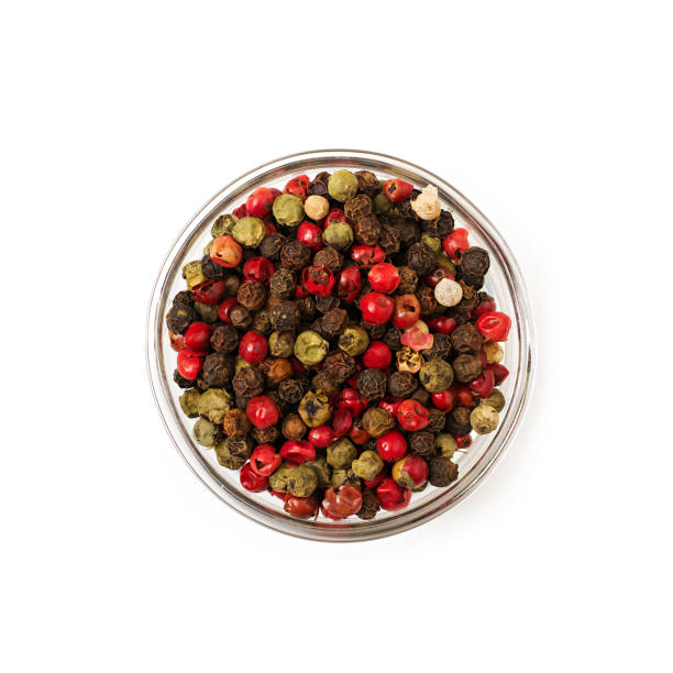 istock Mix of pepper in a bowl isolated on a white background 898679372