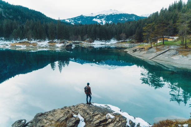 Man walking near Cauma lake in Switzerland