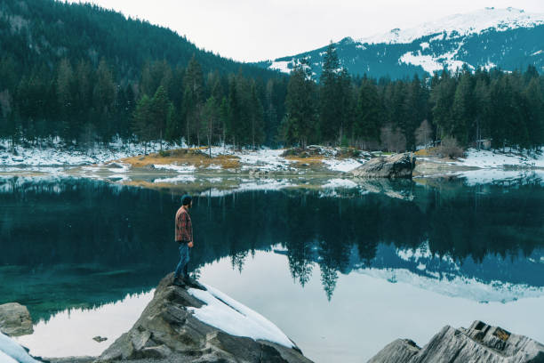 istock Man walking near Cauma lake in Switzerland 898686444