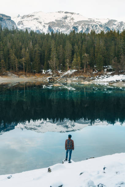 istock Man walking near Cauma lake in Switzerland 898686450