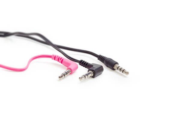 istock Three different audio plugs with parts of cables closeup 898690814