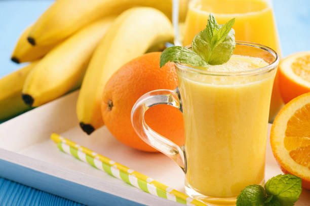 istock Healthy smoothie with orange fruit, kiwi fruit and bananas. 898692130