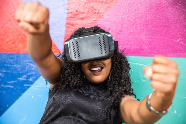 istock African decent woman wearing virtual reality goggles 898695212