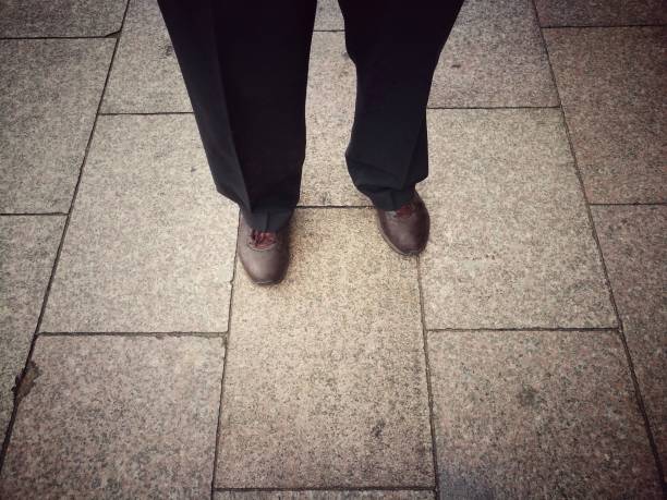 istock Business man standing on concrete floor. 898695226
