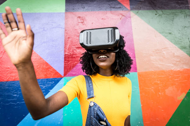 African decent woman wearing virtual reality goggles