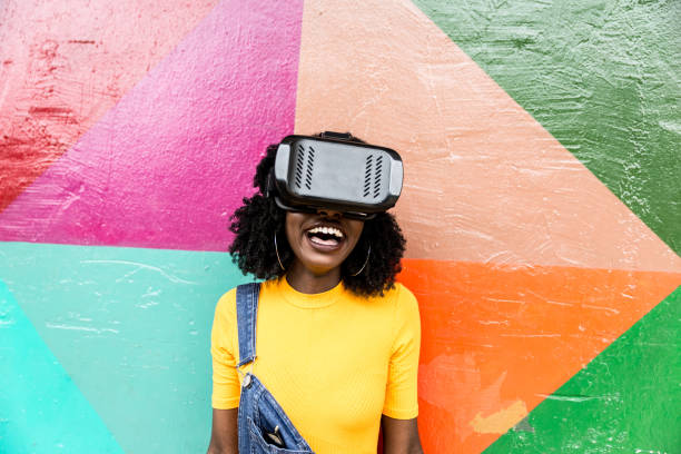 istock African decent woman wearing virtual reality goggles 898695550