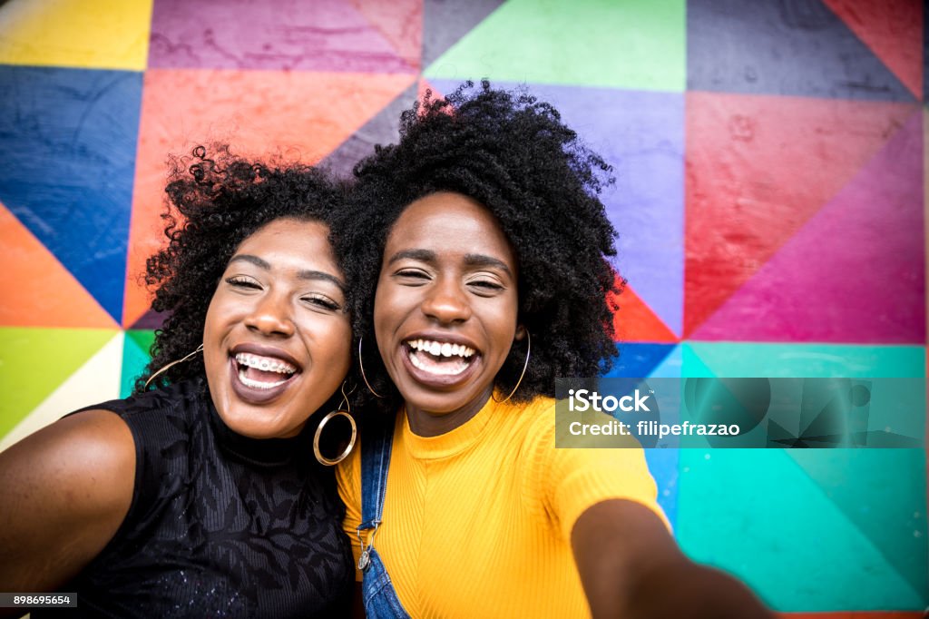 Afro women descent taking selfie photos in the park People collection People Stock Photo