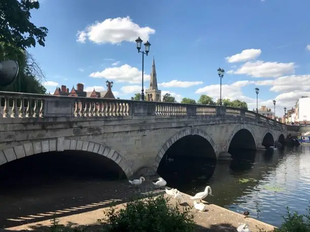 Bedford, UK - July, 2017: Bedford Town Bridge. The picture was taken from the embankment of the River Great Ouse in the centre of Bedford.