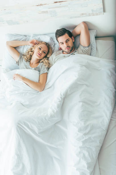 istock young couple in bed 898699800