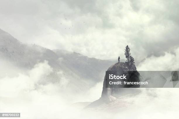 Man Of The Top Of The Mountain In The Fog Stock Photo - Download Image Now - Mountain, Fog, Backgrounds