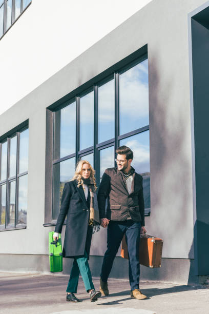 istock young couple with suitcases 898702724