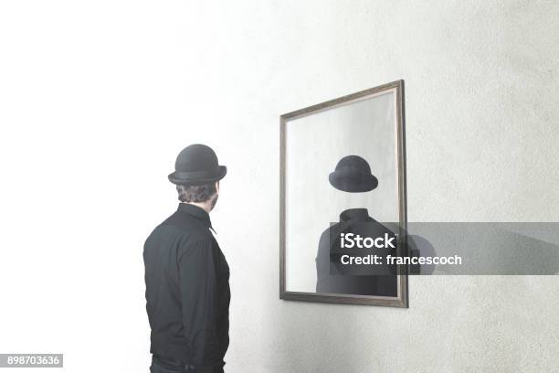 Identity Absence Surreal Concept Man In Front Of Mirror Reflecting Himself Without Face Stock Photo - Download Image Now
