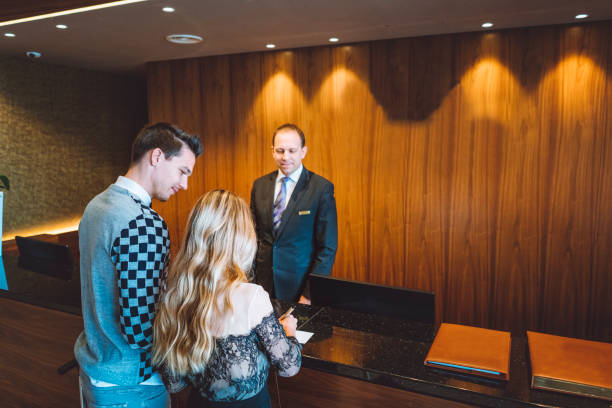 istock Checking in at the luxurious hotel reception 898704016