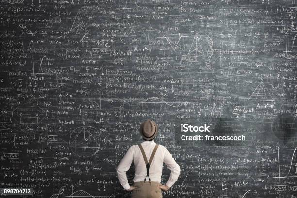 Man Think How To Solve The Problem Stock Photo - Download Image Now - Complexity, Chalkboard - Visual Aid, Mathematical Symbol