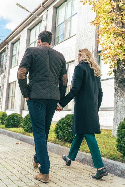 istock couple in autumn outfit walking together 898707530
