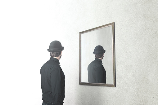man in front of mirror that reflect his back, surreal magritte concept