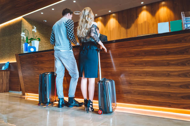 istock Guests getting key card in hotel 898708090