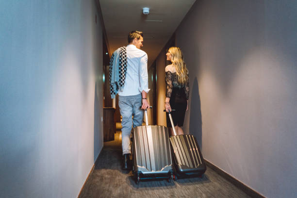 istock Excited couple going to their hotel room 898708454