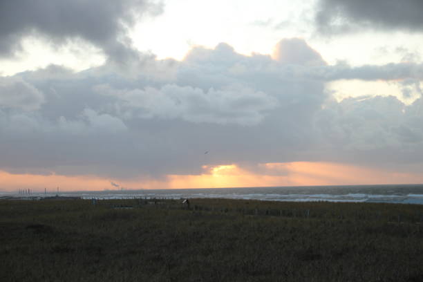 istock Sunset above sea seen on the beach of Katwijk, Netherlands 898708708