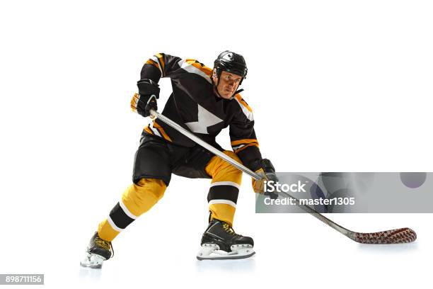 One Caucasian Man Hockey Player In Studio Silhouette Isolated On White Background Stock Photo - Download Image Now