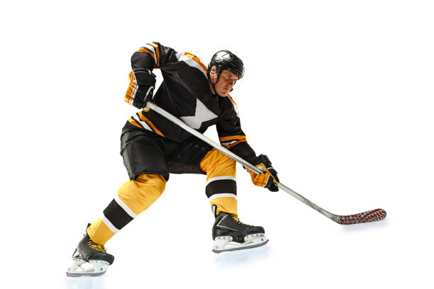 istock one caucasian man hockey player in studio silhouette isolated on white background 898711294