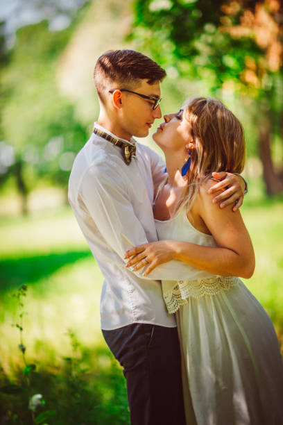 istock Young beautiful couple on a blurred natural background 898712686