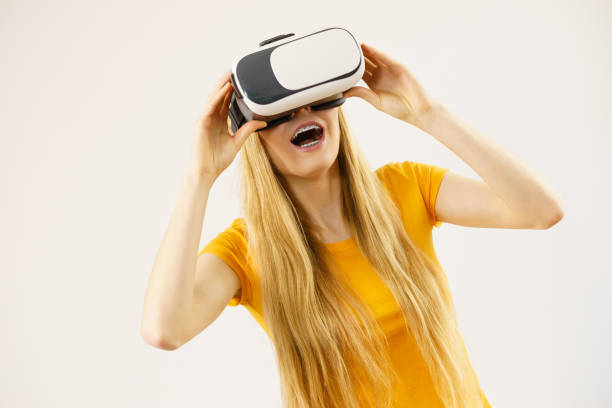 istock Girl wearing virtual reality goggles. 898720248