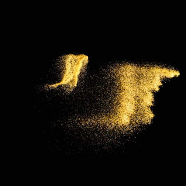 istock Yellow sand explosion isolated on black background. Abstract sand cloud. Golden colored  sand splash against on dark background. Sandy fly wave in the air. 898723472