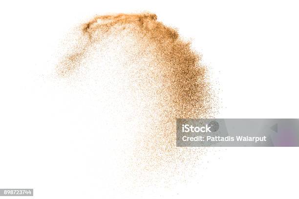 Gold Sand Explosion Isolated On White Background Abstract Sand Cloud Gold Sand Splash Against On Clear Background Sandy Fly Wave In The Air Stock Photo - Download Image Now