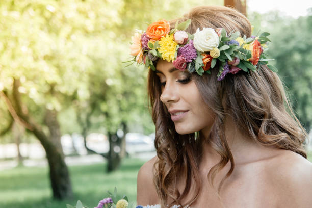 Wedding hair style - bride with flower wreath, bridal event. Wedding hair style - bride with flower wreath, bridal event bridal hair stock pictures, royalty-free photos & images