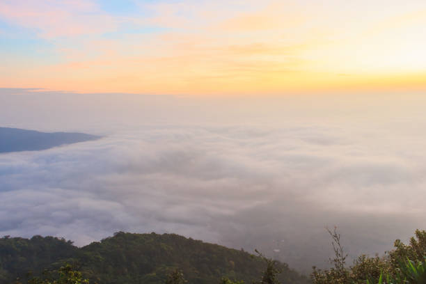 istock sunrise time and fog around mountain 898727636