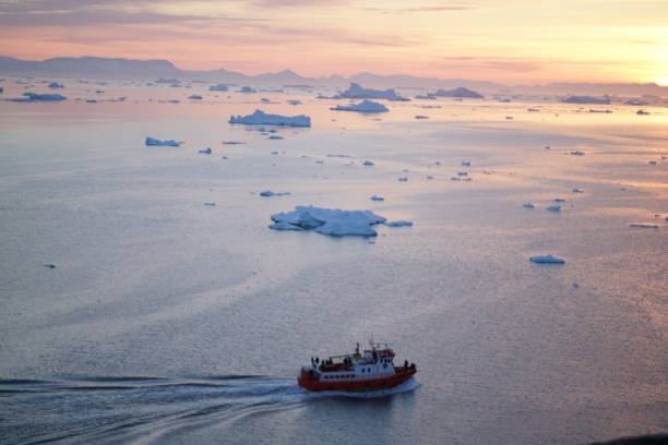 istock Sunset on Arctic Icebergs on Arctic Ocean in Greenland 898727714