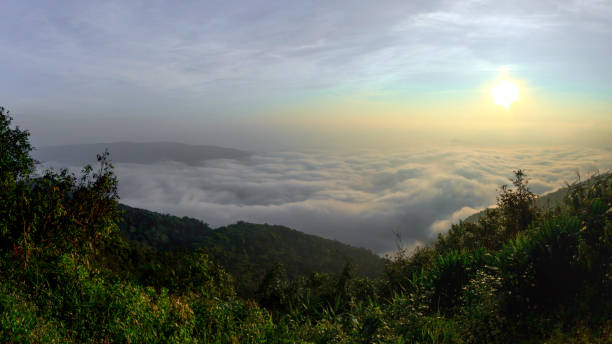 istock sunrise time and fog around mountain 898727726