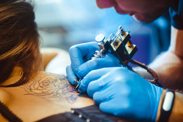 istock master tattoo woman on her back 898728624