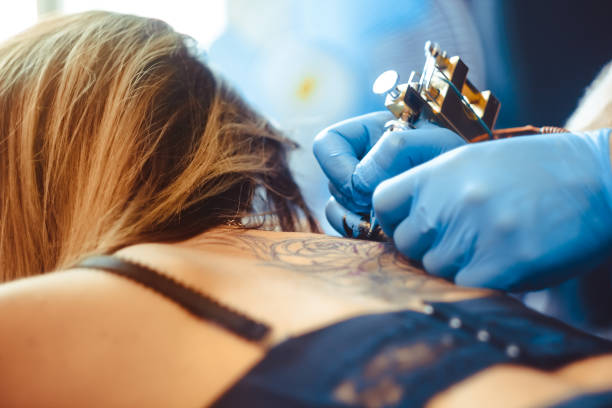 istock master tattoo woman on her back 898728852