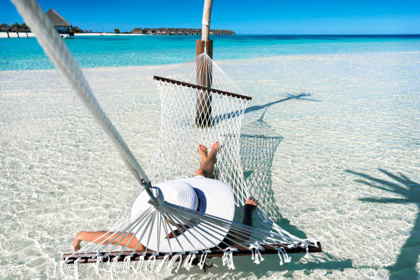 Woman on a hammock in the Malddives