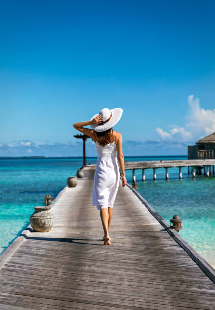 istock Attractive woman on a wooden jetty 898732856