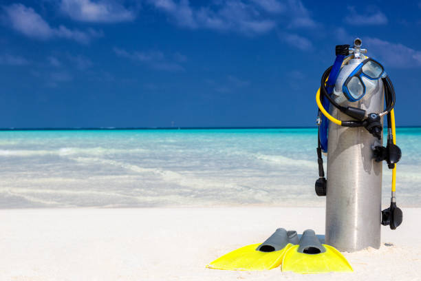 istock Scuba diving equipment on a tropical beach 898732990