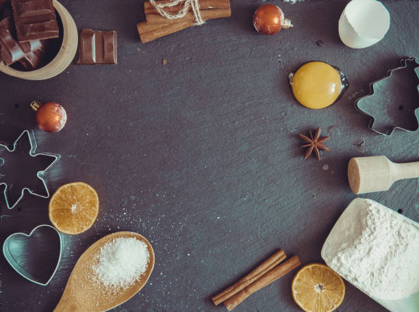 istock Christmas Baking background. Ingredients for cooking christmas baking on dark shale rusty background 898737406