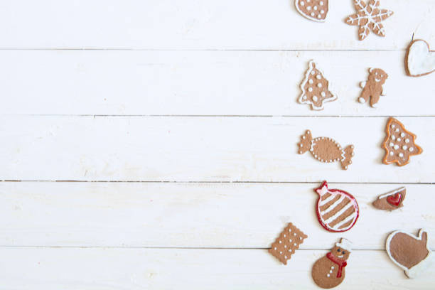 istock Gingerbread cookie for new year on white wooden background top view copyspace 898737712