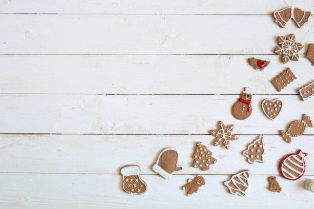 istock Gingerbread cookie for new year on white wooden background top view copyspace 898737950
