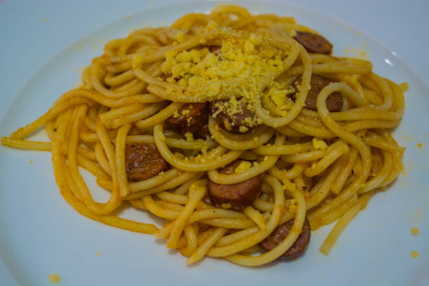 istock Spaghetti pasta and sausages with tomato sauce 898747750
