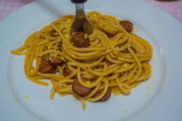 istock Spaghetti pasta and sausages with tomato sauce 898747756