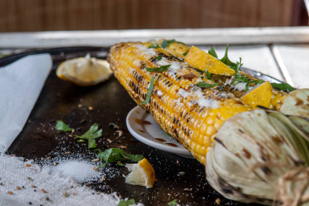istock grilled corn on with lemon, herbs and spices 898752500