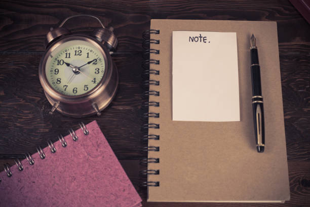 istock Paper note and business tool on wood table. 898752782