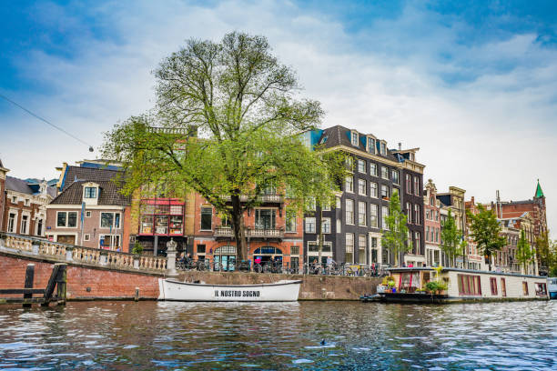 istock Amsterdam, the Netherlands, September 5, 2017 : Amsterdam Netherlands dancing houses over river Amstel 898762344