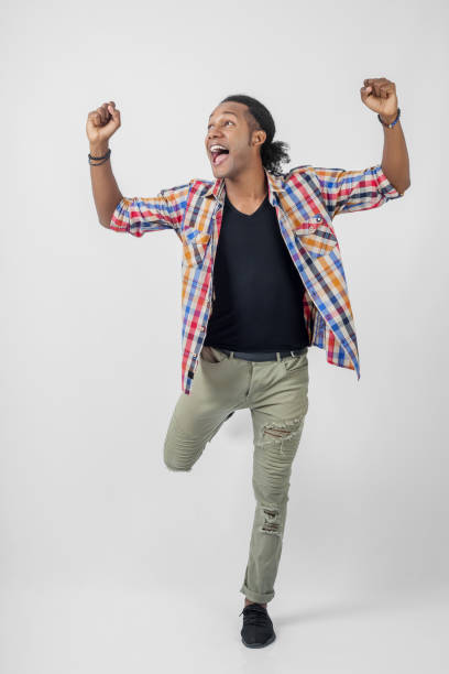 istock young man celebrating his achievement 898764892