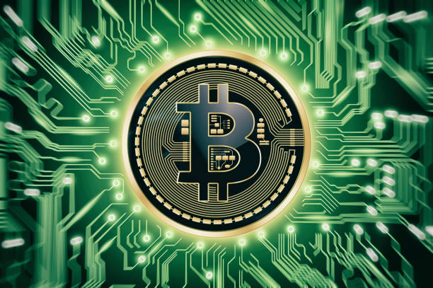 istock Circuit board and Bitcoin cryptocurrency coin over green background 898771832
