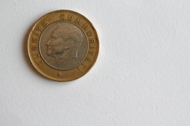 istock One Turkish coin denomination is 1 lira lie on isolated white background - back side 898772482