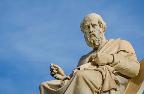 Marble statue of the great Greek philosopher Plato on background the blue sky.